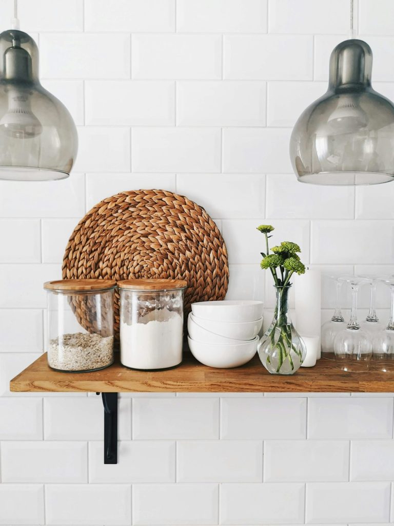 two-clear-glass-jars-on-brown-wooden-floating-shelf-exf1n6-utzm